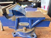 Side view showing Mastercraft badge, swivel base, and anvil surface