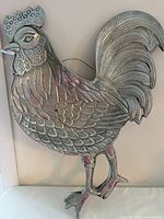 Full view of silver metal rooster wall décor