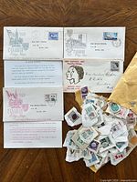Group shot of four FDCs, information sheets and loose stamps