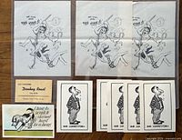 All items laid out: three Vine prints, five Our Competitor cards, Donkey Roast card, dog cartoon card