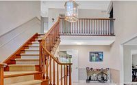 Lantern chandelier installed in two-storey foyer