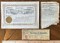 All three documents laid out with ruler for scale