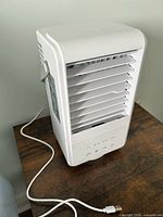Front view of white USB air cooler showing vents and control panel