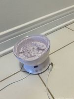 Lamp front showing controls and USB cable