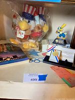 Overall lot with plush mascot, program, medal plaques, tickets visible