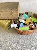 overview of basket with assorted boxes and large floral box