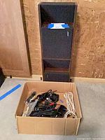 Pair of Bose floor speakers with box of cables