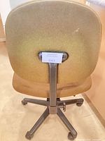 Rear view of brown fabric office chair