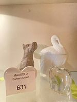 All four items together: dog figurine, milk glass swan dish, heart plaque, clear glass heart paperweight