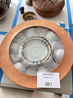 Boxed view of porcelain tea cup and saucer set showing pattern and packaging