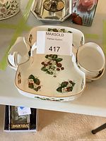 Full set showing divided dish, creamer, sugar bowl