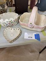 All three porcelain pieces grouped on table