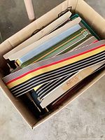 Top view of box with multiple ribbon cards of varying colors and widths