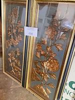 Both framed floral relief panels front view