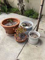 Group shot of all four planters showing materials, colors and saucers