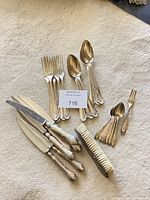 All flatware pieces and brush grouped