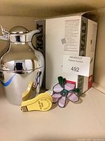 All three items grouped: carafe, stained glass flower, tape dispenser