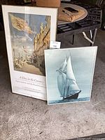 Both framed prints leaning against wall, shows relative size and frames