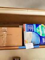 Shelf view showing Vicks humidifier box and plain box containing unbranded humidifier