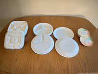 All plates arranged on table showing four types and stacks