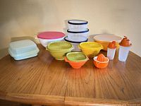 All thirteen Tupperware items displayed on table