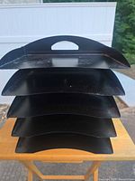 Front view showing five staggered trays and top handle