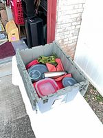 Top view of tote containing containers, thermos, napkins