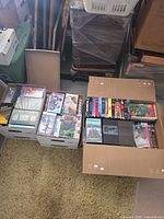 Two cartons filled with assorted VHS tapes