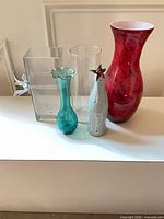 Group of five vases on surface