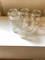 All six clear glass mason jars grouped