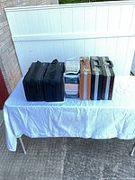 Six cassette storage cases arranged on table