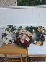 Three wreaths side by side showing overall lot contents
