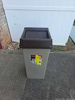 Front view showing entire trash can with lid installed