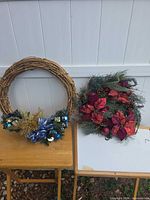 Both wreaths side by side for size and theme comparison