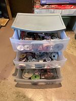 Full view of 3-drawer storage unit with contents