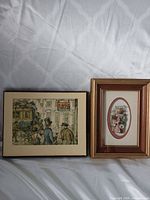 Both framed Anton Pieck prints side by side