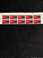 Front view of full strip of ten stamps
