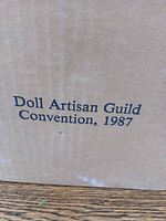 Box front showing printed Doll Artisan Guild Convention, 1987 text