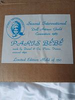 Box label showing Paris Bébé, 2nd International Doll Artisan Guild Convention 1983, limited edition mould of 750