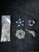 Group shot of all brooches and filigree pieces