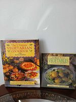 Both hardcover cookbooks front covers visible