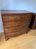 Front view showing overall dresser form and drawer arrangement