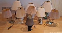 Group shot of all nine lamps showing bases and shades