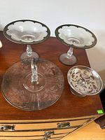 All four glass items on dresser top