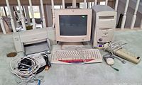 Group view of tower, monitor, printer, peripherals and cables