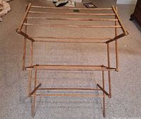 Front view of rack fully opened showing overall form and tiers