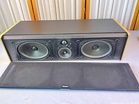 Front view of Boston Acoustics VR920 with grille removed and grille shown