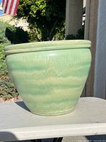 Side view of green glazed planter