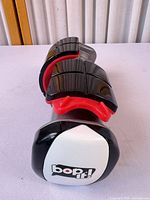 Front view showing white bop it! end cap and overall form