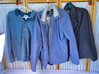 Front view of all three jackets hanging